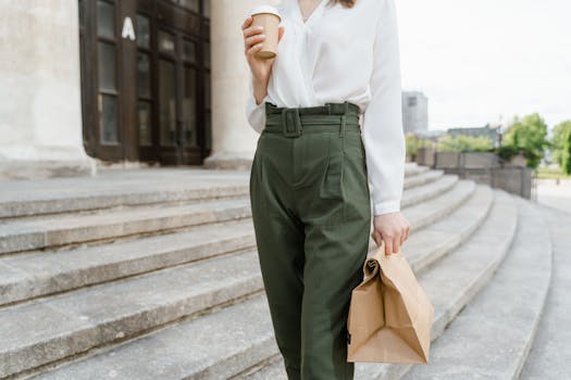 A professional taking a break outdoors with a coffee cup