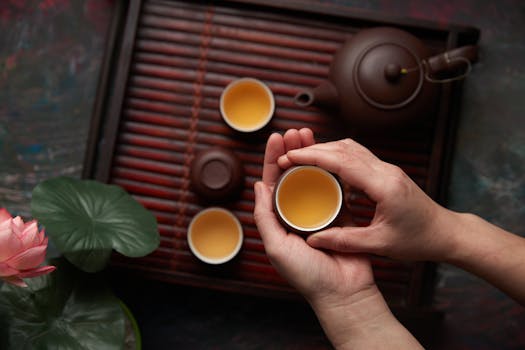 a cup of green tea with leaves