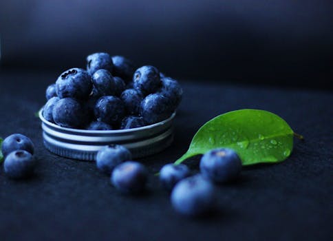 assorted superfoods including berries and leafy greens