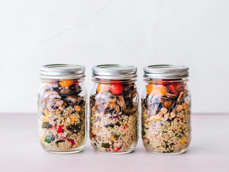 meal prep containers with whole grains and greens